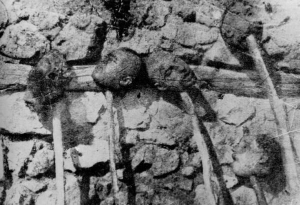 Heads of Armenians massacred by the Turks are shown as trophies.