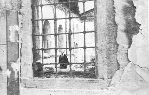 The patriarch wandering in the ruins of a burnt church.