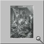 Hellenes look at the destruction of their properties.