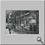 People looking at destroyed Hellenic property.