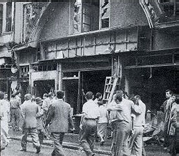 People looking at destroyed Hellenic property.