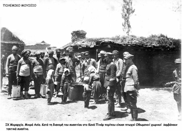 Hellenic soldiers giving food to poor Ottomans during the war against Turkey.