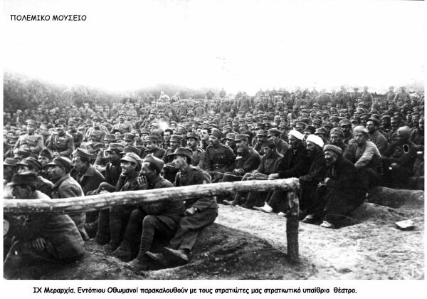 Hellenic soldiers and Ottomans watch a play in an open theater during the war against Turkey.
