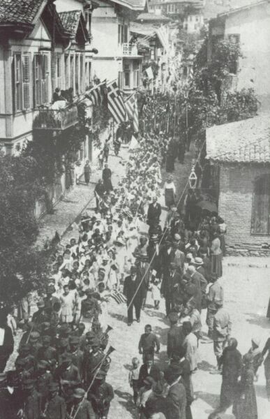 The people of Panormos welcomes the liberating Hellenic army. On the photograph, the central street of the city.