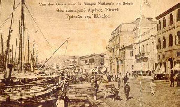 The quay, the Hellenic National Bank and boats.