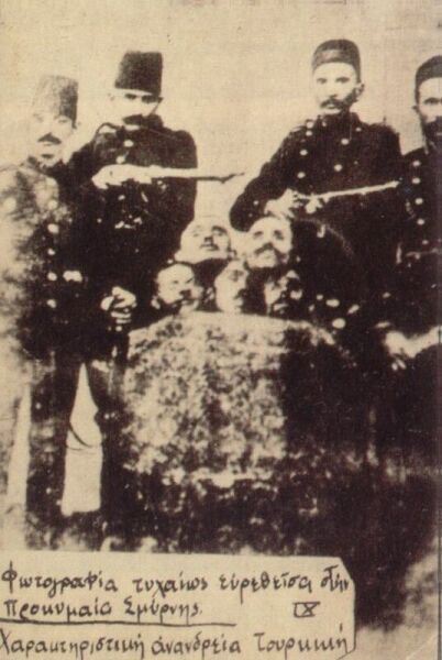 Turkish soldiers posing proudly with heads of their Hellenic victims.
