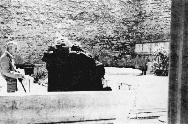 Hellenes watching destroyed graves.